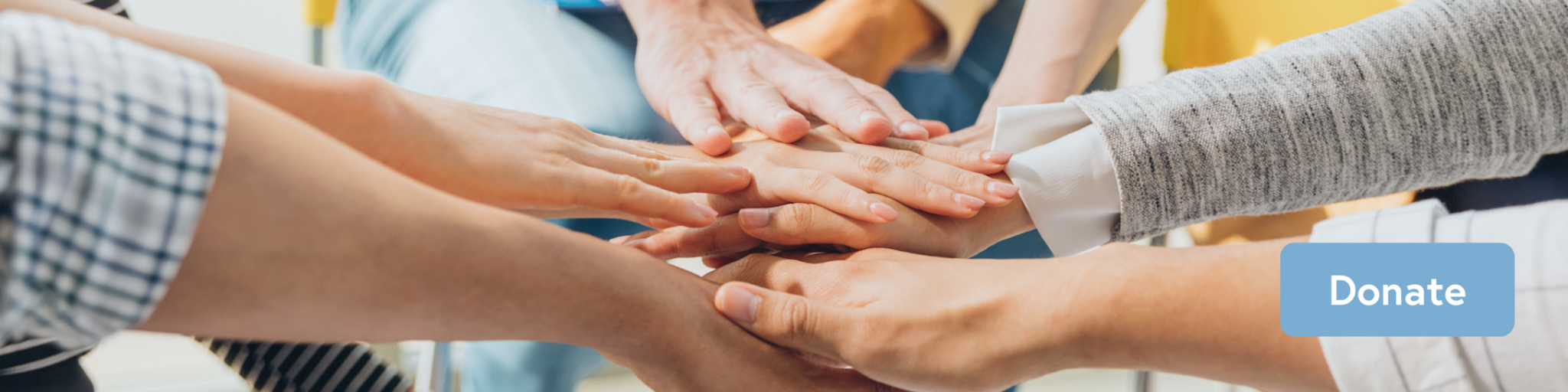 Wide narrow image of hands together in a huddle and blue donate button.