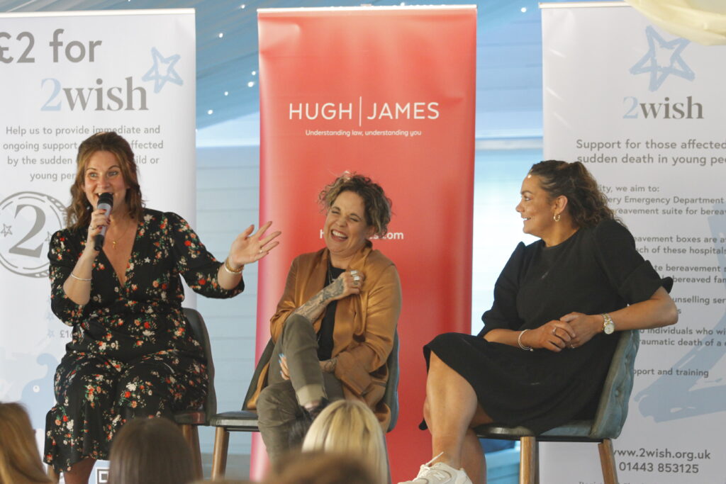 rhian mannings, amy wadge and nia jones sat on stools laughing