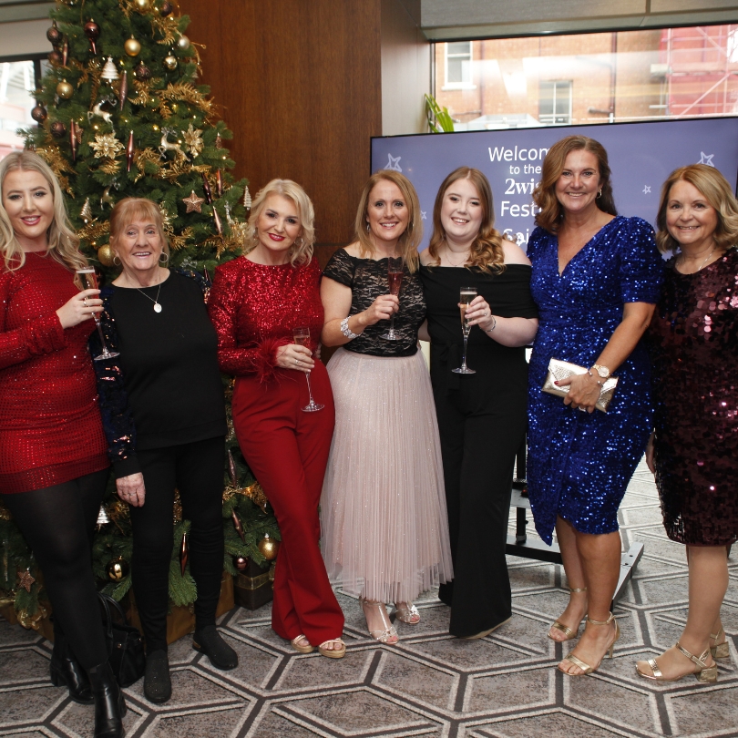 A group photo of women at the festive soiree event