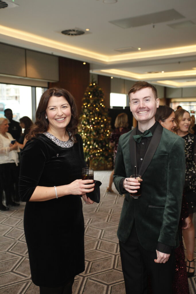 a man and a woman at the festive soiree