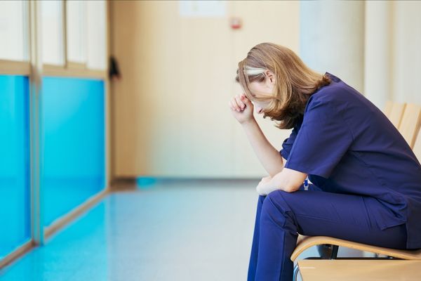 Nurse upset in hospital corridor