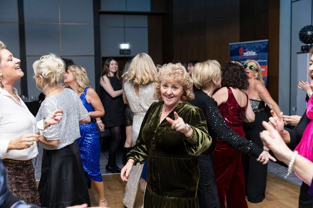 Women dancing at a festive event.